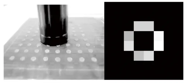 Fig. 9 Experiment of a pen cap Fig. 9 Experiment of a pen cap